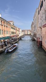 Boats in canal in city