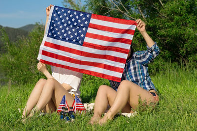 Women with usa flags, patriotic american national holiday 4th of july independence day