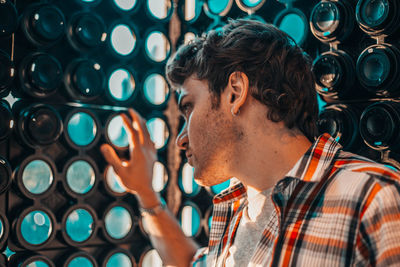 Close-up of man looking through window