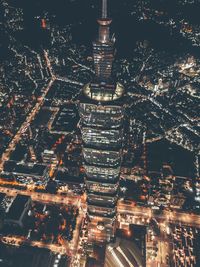 Aerial view of city lit up at night