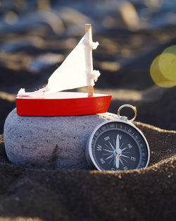 Stilllife on beach with navigational compass 