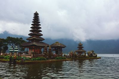 Traditional temple against cloudy sky