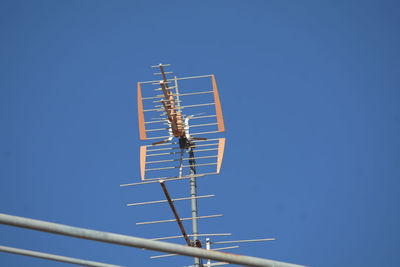 Low angle view of airshow against clear blue sky