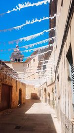 Alley amidst buildings in city