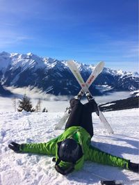 Scenic view of snow covered mountains against sky