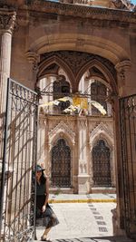 Side view of woman in historic building