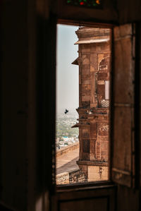 Historic building seen through window