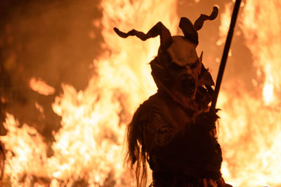 Man wearing spooky costume during halloween at night