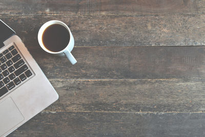 High angle view of coffee cup on table