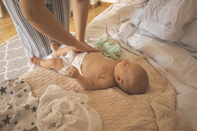 High angle view of baby boy sleeping on bed