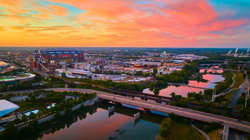 High angle view of city at sunset