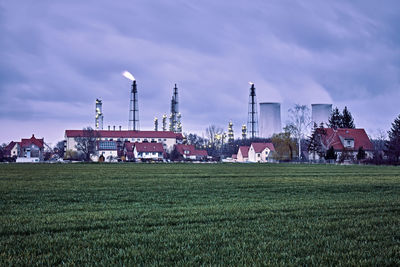 Built structure on field against sky