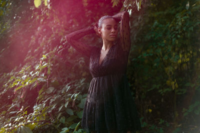 Portrait of a beautiful young woman in forest