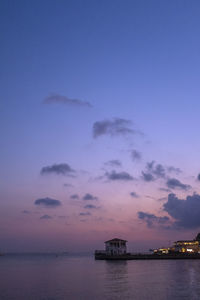 Scenic view of sea against sky at dusk