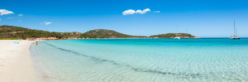 Scenic view of sea against blue sky