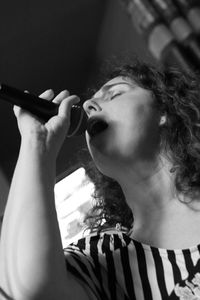 Woman singing on microphone