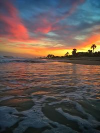 Scenic view of sea against orange sky