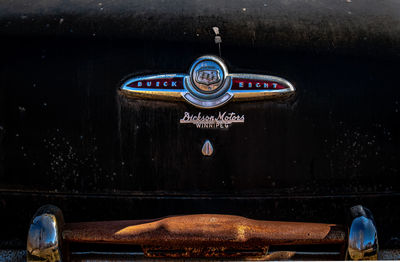 Close-up of old vintage car on wall