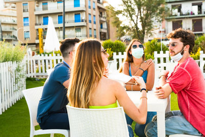 Friends sitting on table