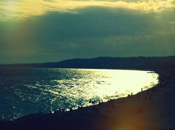 Scenic view of sea against cloudy sky