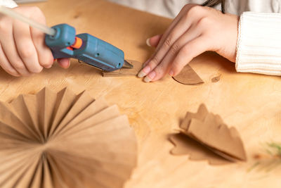 Cropped hand of person working on table