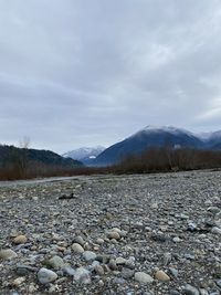 Scenic view of landscape and mountains against sky