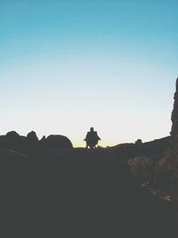 Silhouette of mountain against clear sky