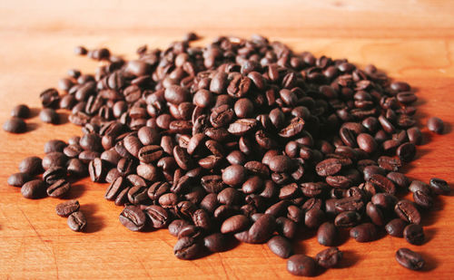 Close-up of coffee beans on table