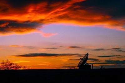 Silhouette landscape against scenic sky