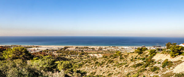 Scenic view of sea against clear blue sky