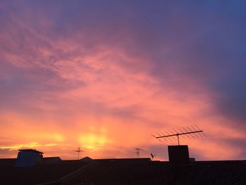 Low angle view of building against sky at sunset