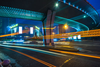 Light trails on road in city at night