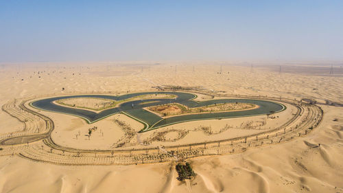 Aerial view of desert against clear sky