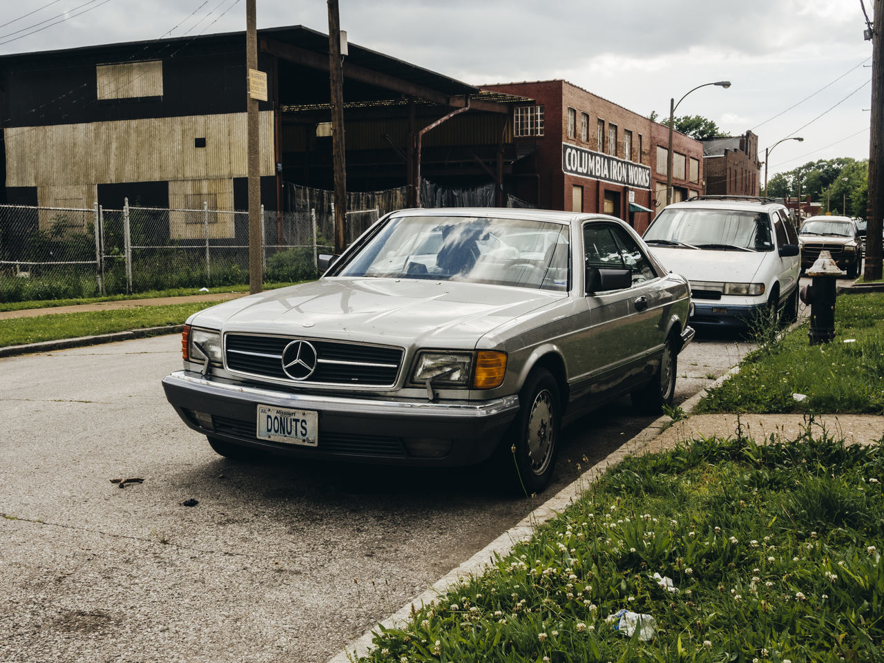 transportation, mode of transport, land vehicle, stationary, sky, grass, parked, day, parking, outdoors, no people, cloud - sky, cloud, nature