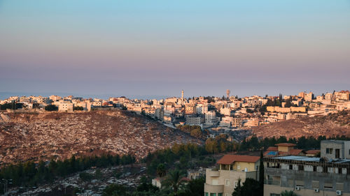 Nazareth city minutes after sunrise with magnificent dawn light, israel.