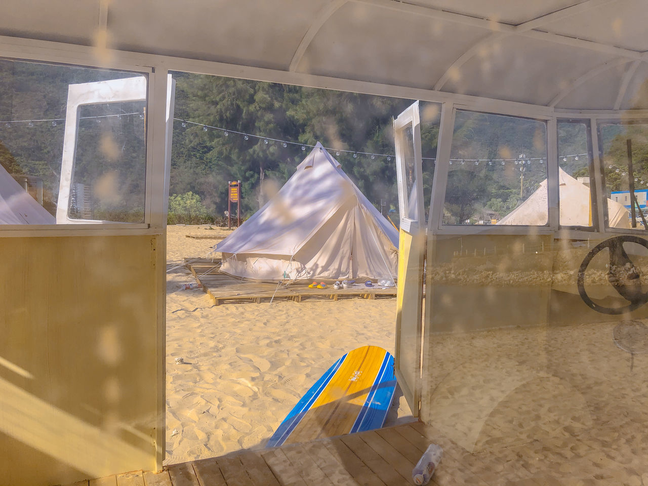 TENT BY GLASS WINDOW