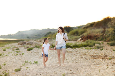 Full length of couple on beach