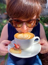 Close-up of woman drinking coffee