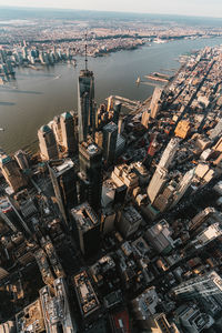 High angle view of sea and buildings in city