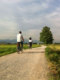 Person riding bicycle on grass