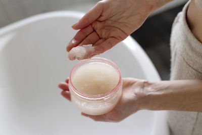 Midsection of woman washing hands