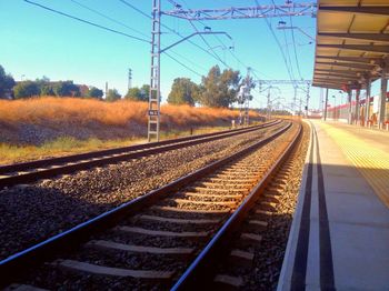 Railroad tracks against clear sky