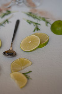 High angle view of fruits and leaves on table