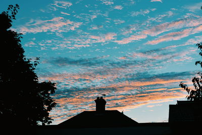 Silhouette of roof against sky