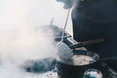 Midsection of person preparing food