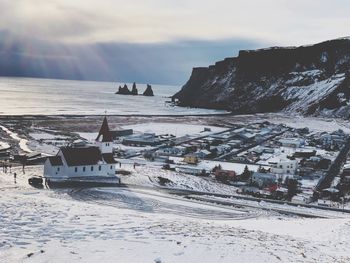 Scenic view of sea against sky during winter