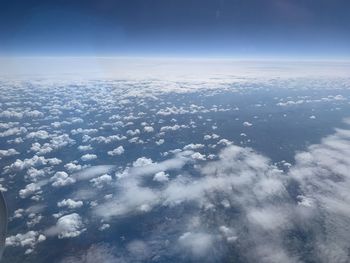 Aerial view of over clouds in sky