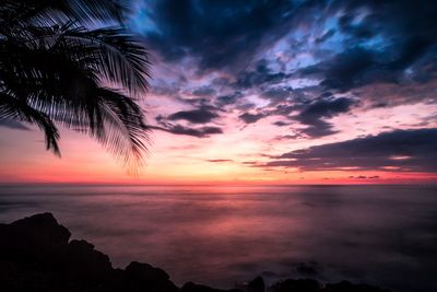 Scenic view of sea against romantic sky