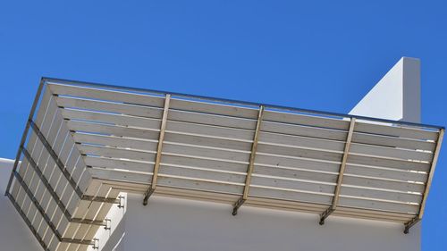 Low angle view of building against clear blue sky