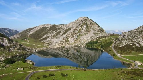 Scenic view of lake and mountains against sky